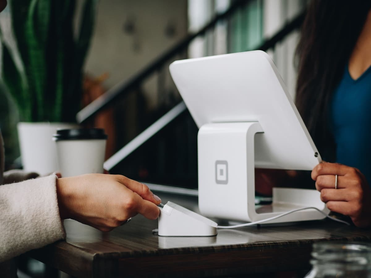 Customers gathering around a brand experience designed to build connection and loyalty